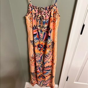 Mara Hoffman orange midi dress with buttons down the front and tie at chest.